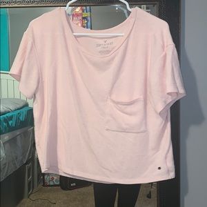 A pink short sleeve shirt.